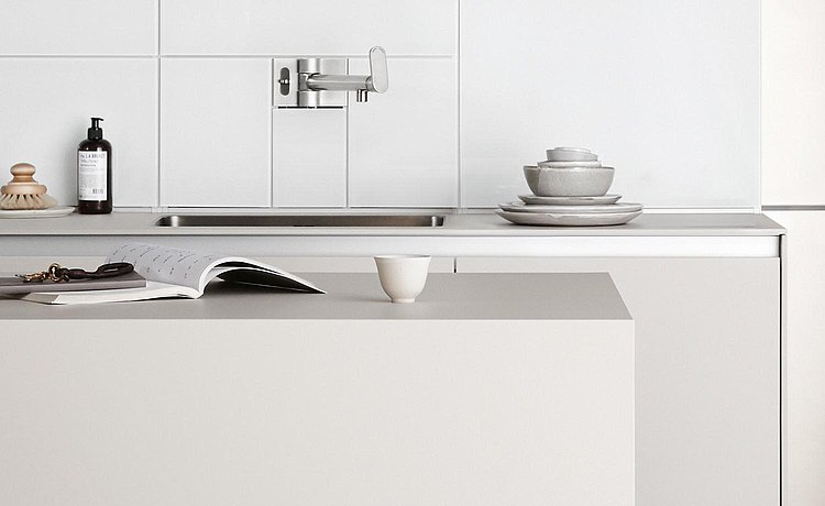 Large work surface on the kitchen island. Link: Shape and space for ideal storage and preparation of dishes