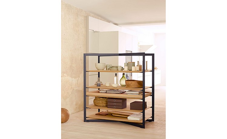 b Solitaire shelf as both a separating and connecting element between kitchen and living space