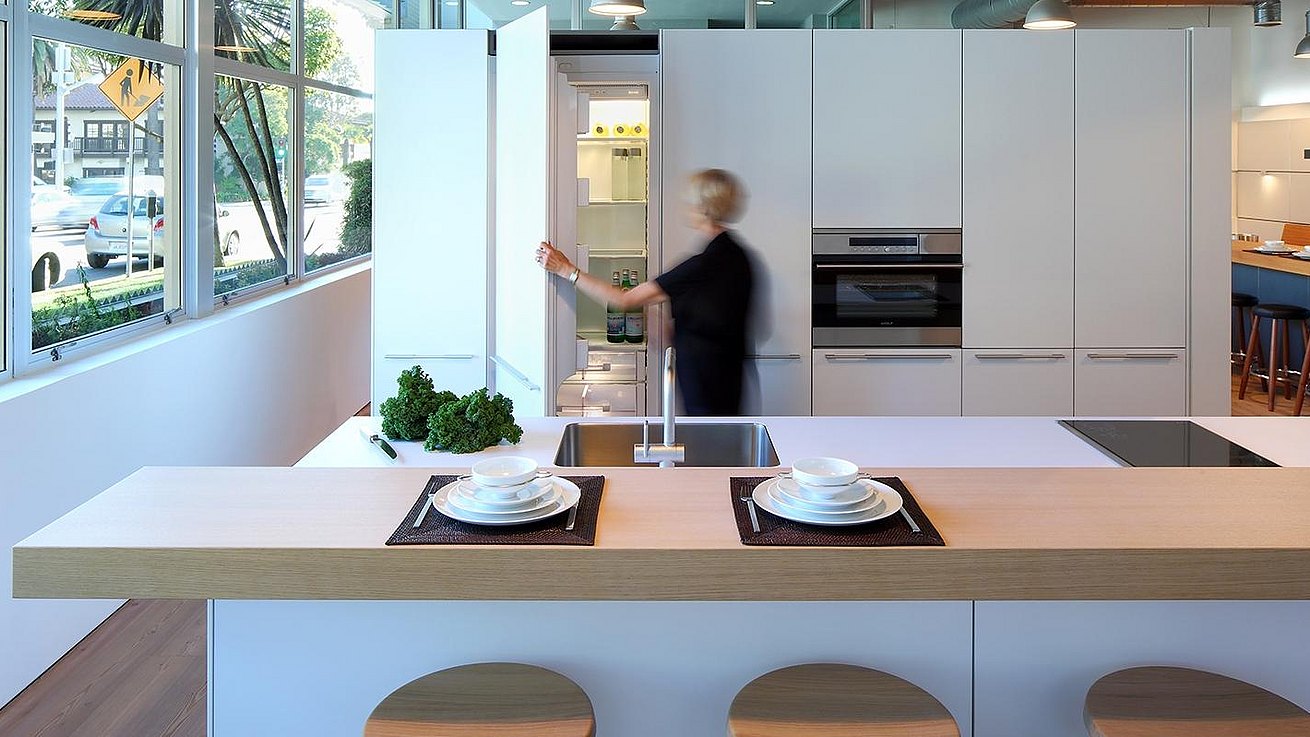 b3 kitchen in all alpine white laminate with bar top in natural grey oak veneer.