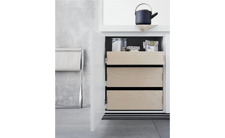 Different height drawers behind the front door panels make the cabinet contents particularly easy to access 