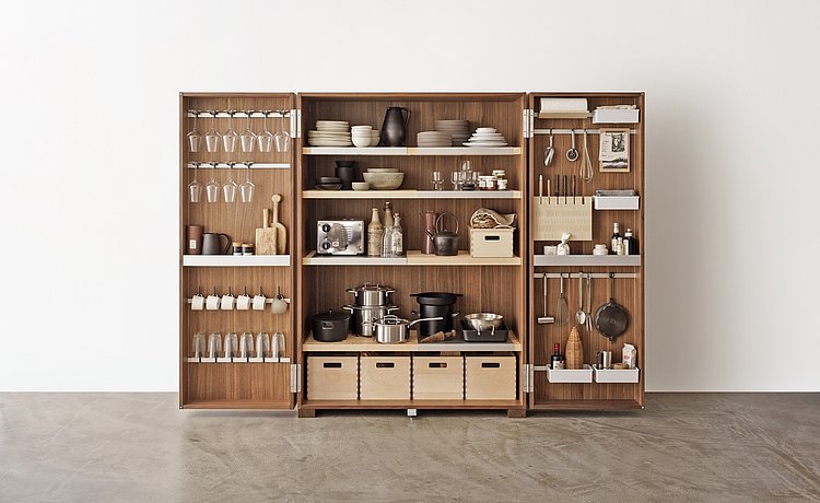Practically equipped tool cabinet with armature for storing glasses, shelves, compartments, boxes, rods, and knife block
